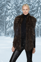 Person wearing a brown fur vest 