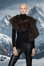 Person wearing a black turtleneck, leather pants, and a brown fur vest 