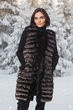 Woman wearing a long fur coat