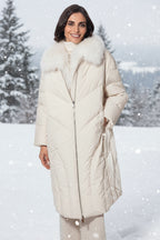 Woman wearing a long white coat with fur trim