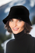 Woman wearing a black bucket hat and black turtleneck