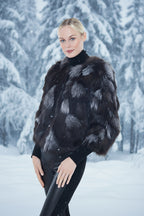 Woman wearing a black and gray fur coat 