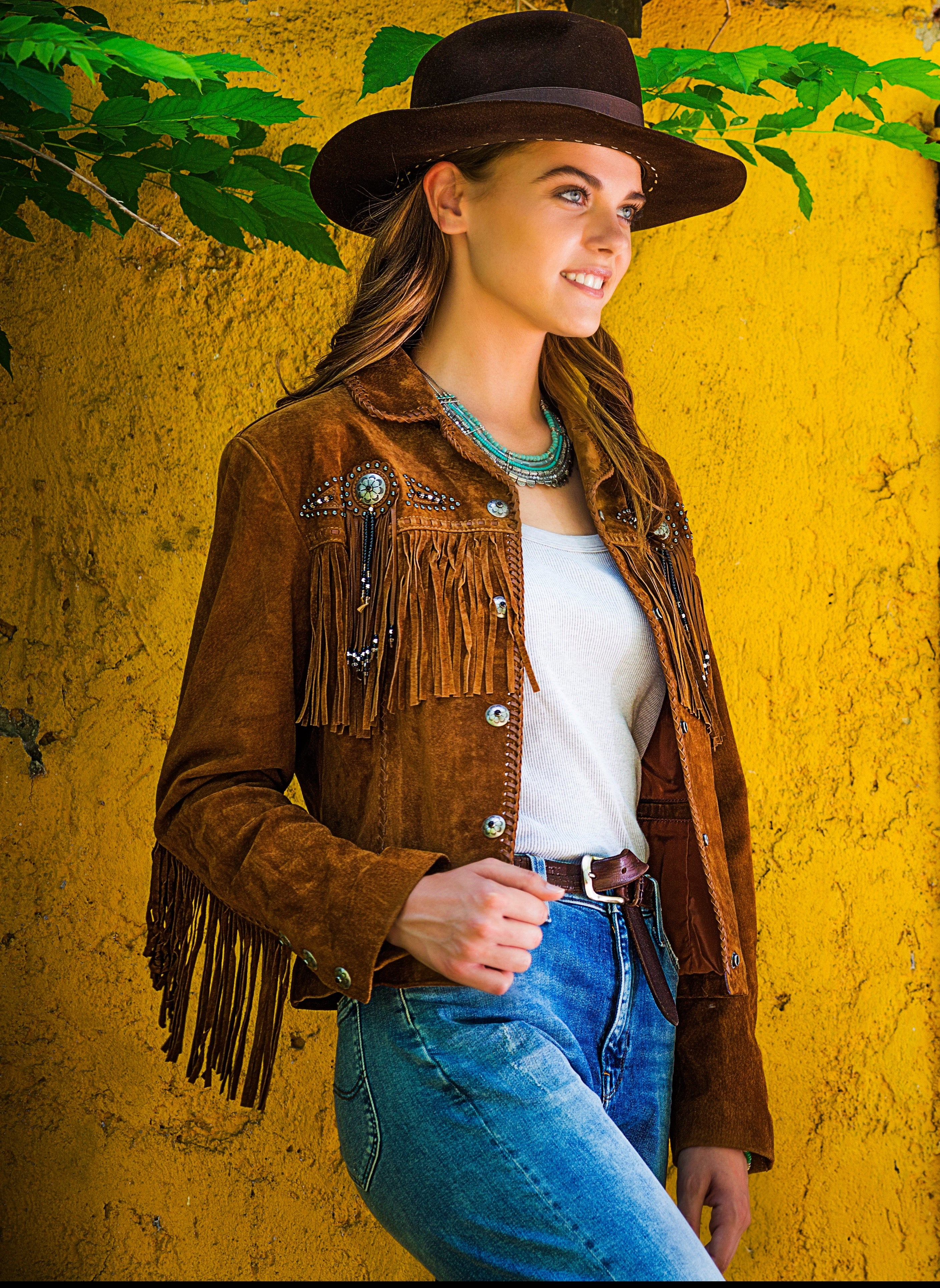 Woman Wearing Suede Jacket with Conchos
